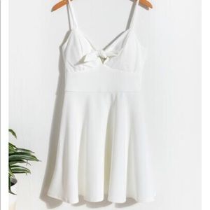 All white, never been worn, NWT, swing dress. Adjustable straps and cute cut out